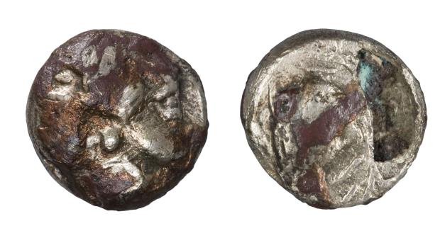 One of the counterfeit fractions of the Hoard from the neapolis of Emporion. Notice how a part of the plating has peeled off.