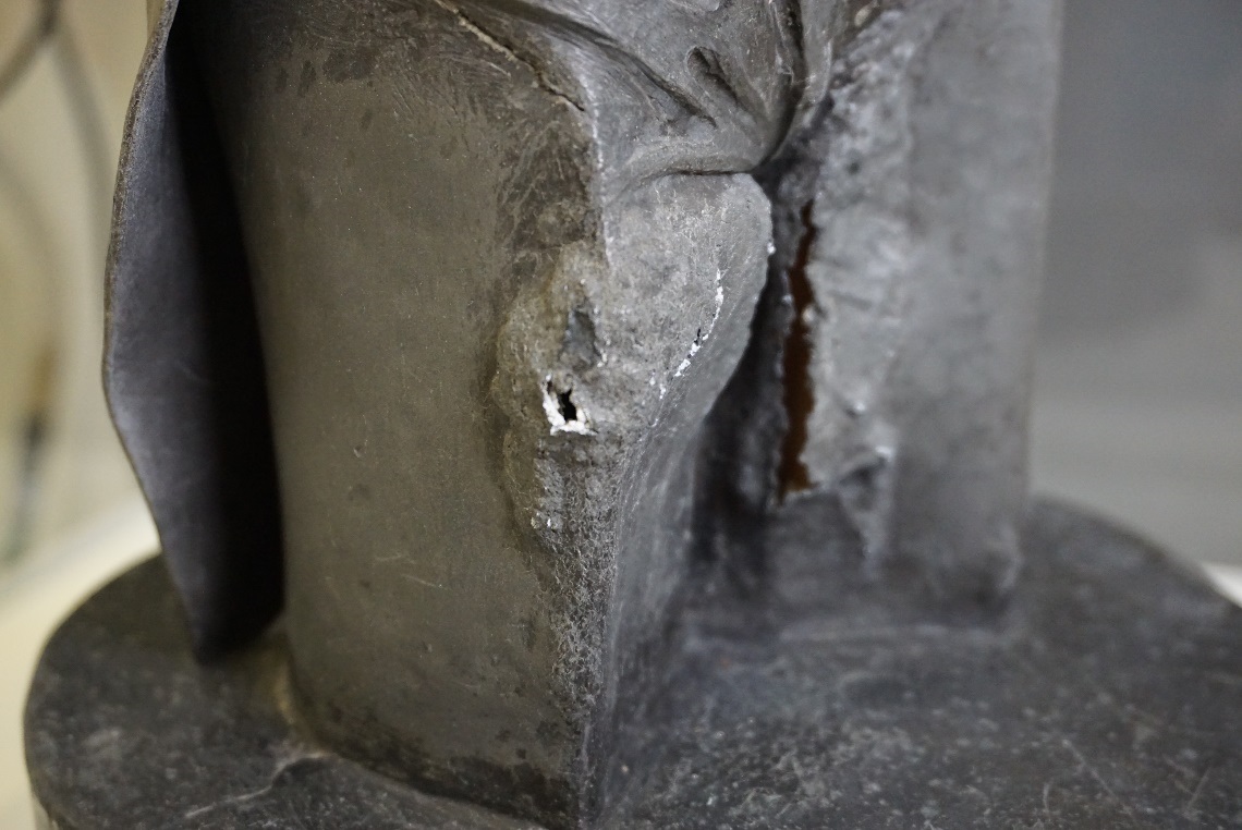 Detail of the carbonation of the lead on the legs as it currently appears