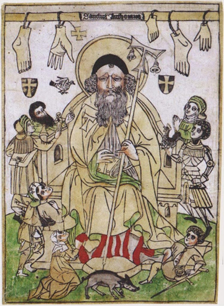 Engraving representing Saint Anthony the Abbot with his attributes: amputated limbs, hanging at the top; ergotism patients mutilated or with crutches; the tau of the staff and of the habit; bells (on the staff or carried by the sick). At the bottom,  flames are schematically represented (a reference to the burning pain of the "Saint Anthony’s fire") and the pig. Some patients bring offerings or votive offerings. German woodcut of the 15th century (Source: “Santos sanadores”. Barcelona: Laboratorios Ciba, 1948).